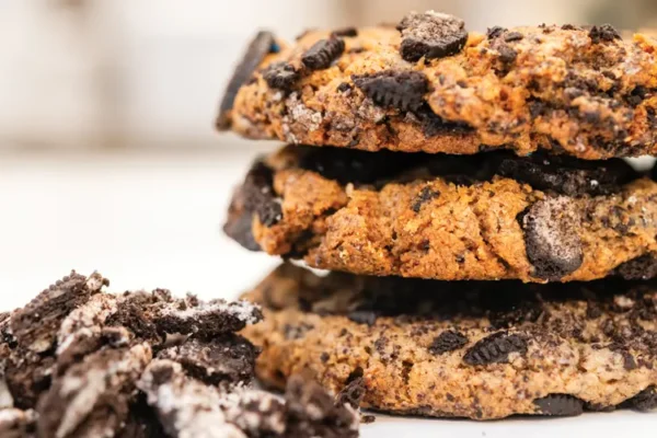 Three delicious Oreo cookies stacked high.