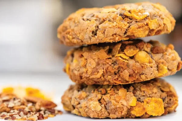 Three delicious cereal cookies stacked high.