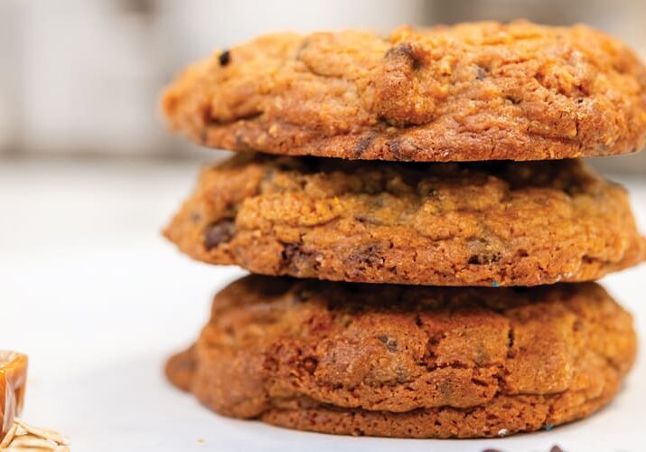 Stack of three delicious chocolate chip cookies.