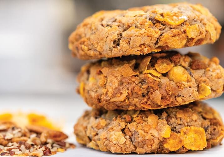 Three delicious cereal cookies stacked high.